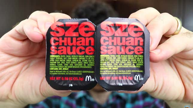 hands holding szechuan sauce